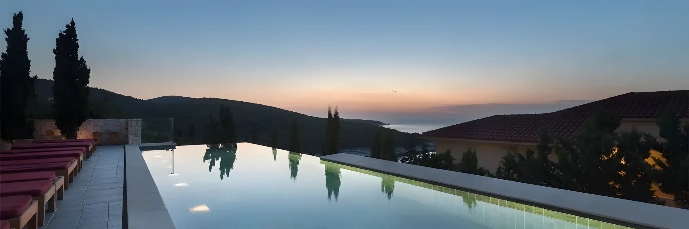 Swimming pool in hotel overlooking ionian sea